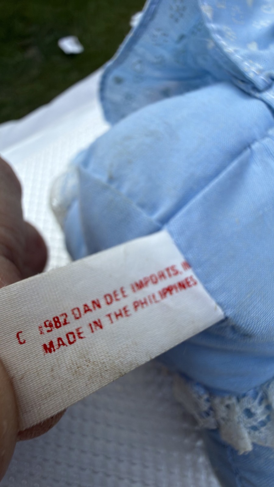 Close-up of the sewn-in tag reading 1982 Dan Dee Imports, Made in Philippines
