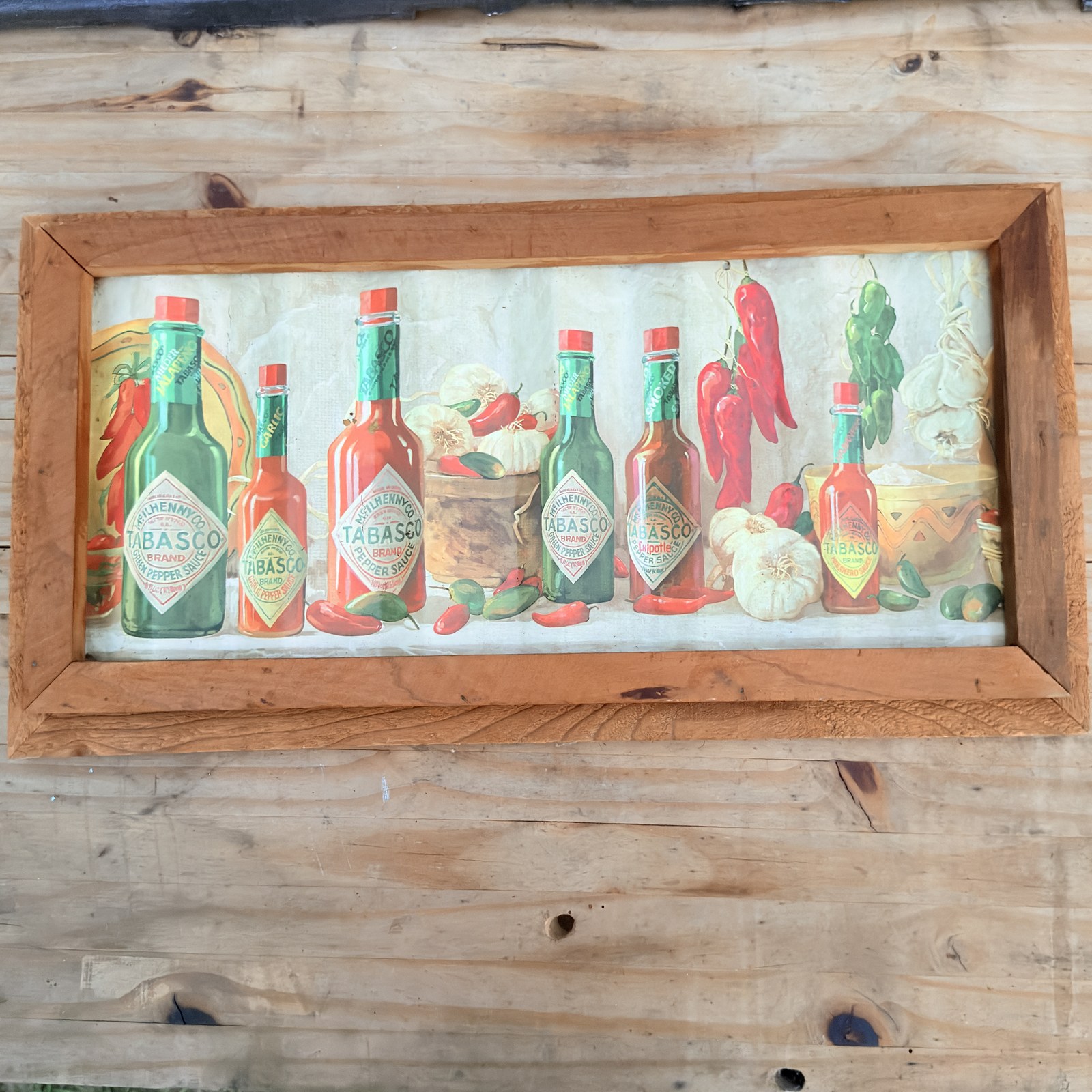 Framed Tabasco Brand corrugated tin wall panel angled view