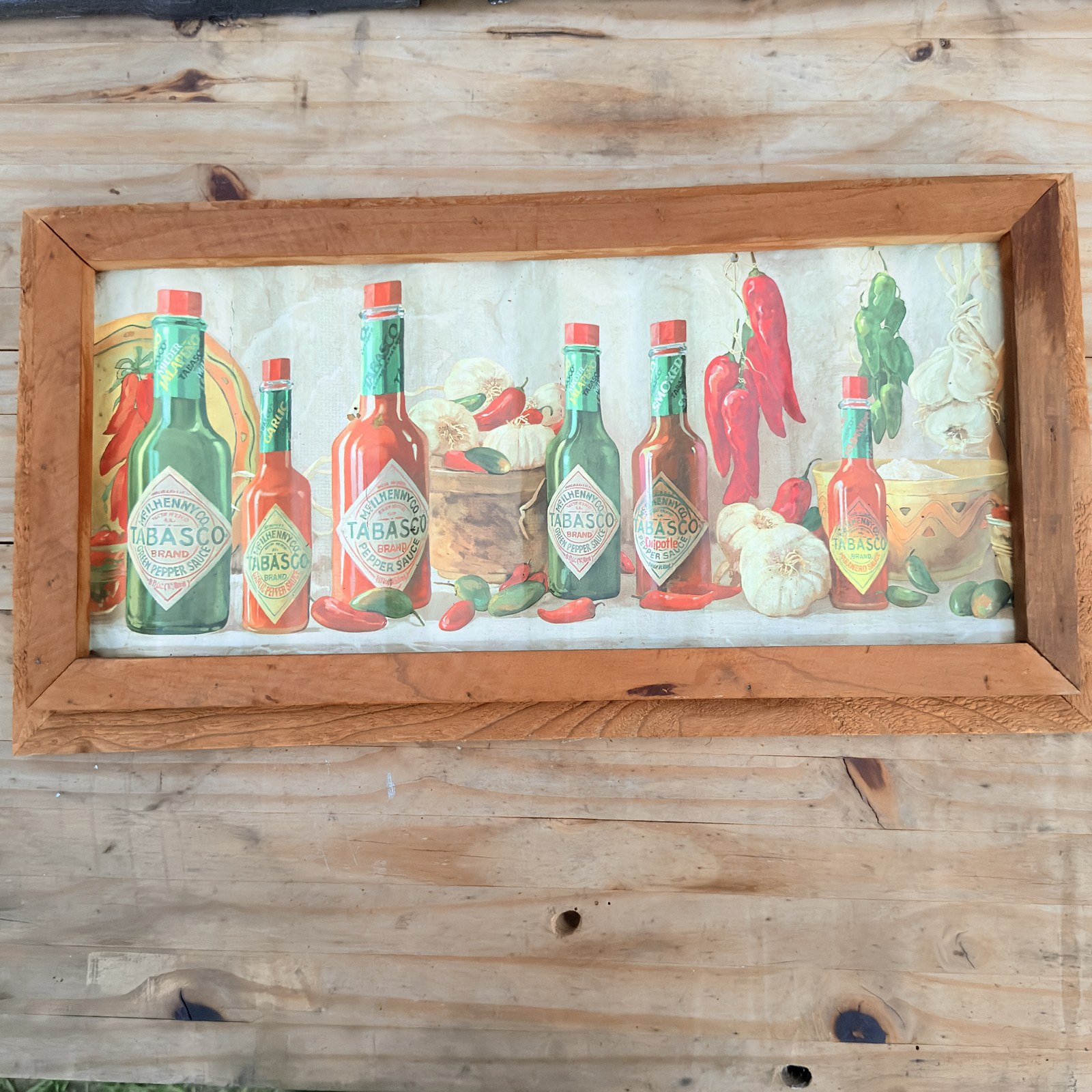 Framed Tabasco Brand corrugated tin bottle detail