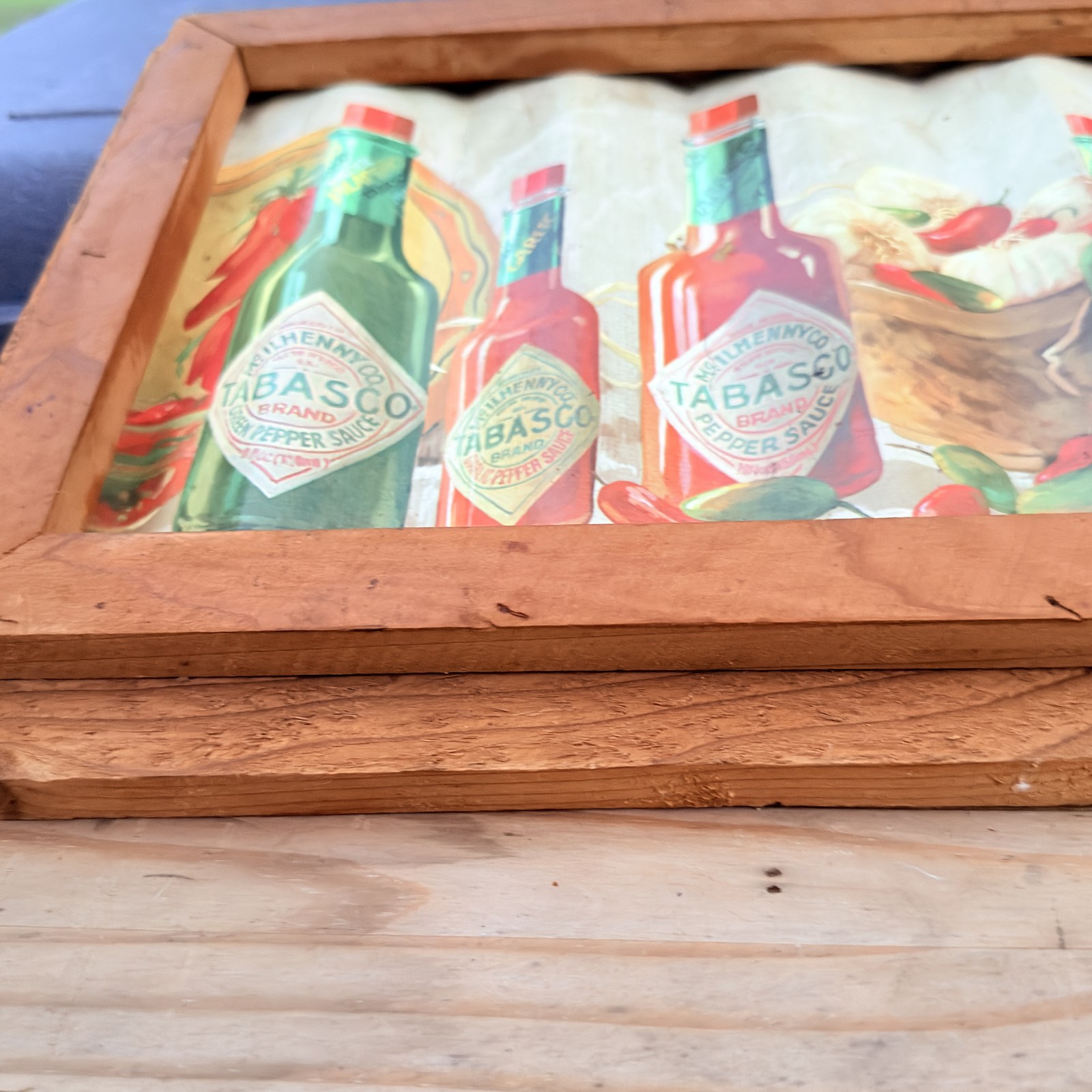 Framed Tabasco Brand corrugated tin peppers and garlic detail