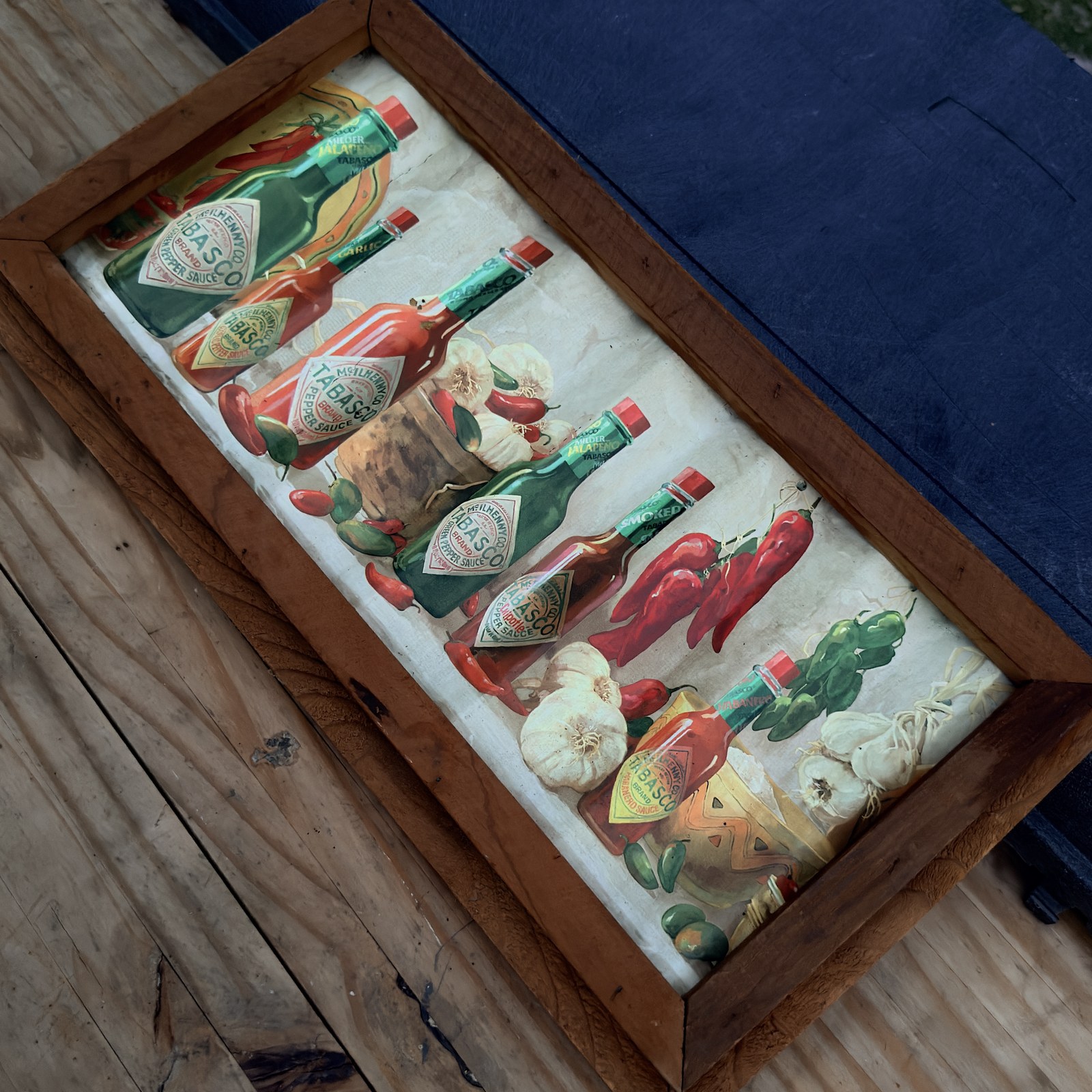 Framed Tabasco Brand corrugated tin reverse and hanging hardware