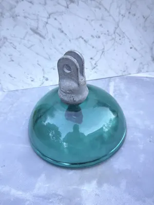 Sediver aqua glass suspension insulator — angled front view