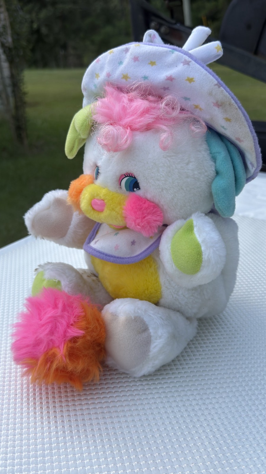 Baby Cribsy Popple front three-quarter view showing lime green ears and paw pads